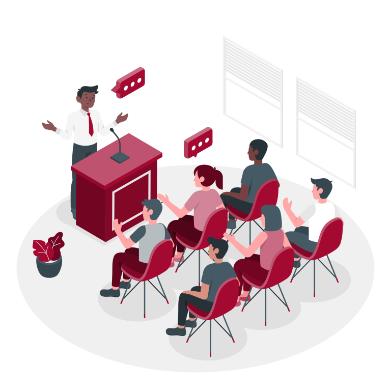 Ein Referent steht an einem Tisch und spricht zu einem Publikum in einem Konferenzraum.