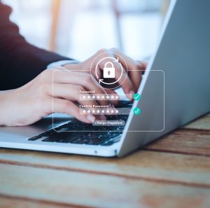 Reset password concept. Lock icon, security code showing on change password page while business person using laptop computer, vertical style. Cyber security technology on website for data protection.